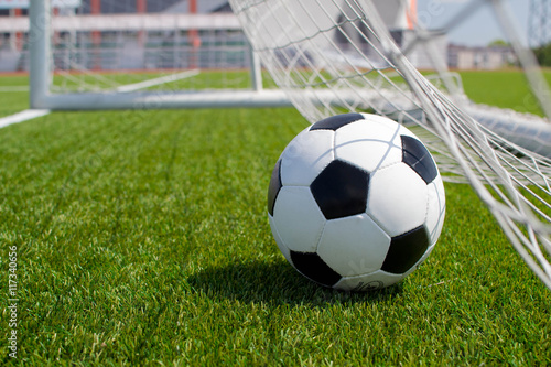 soccer ball in net © StockBox