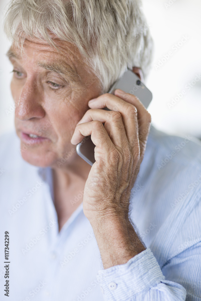 Senior man talking on mobile phone Senior man talking on mobile phone