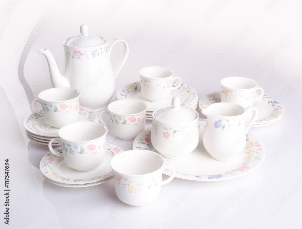 teapot and cup set . teapot and cup set on a background teapot and cup set . teapot and cup set on a background