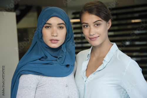 Portrait of two businesswomen smiling photo