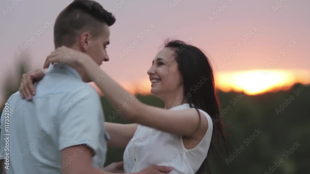 Couple in love at sunset. The guy turns Woman. Smile. Laugh. Couple in love at sunset. The guy turns Woman. Smile. Laugh.