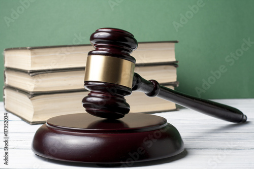 Fotografia, Obraz Law concept - Book with wooden judges gavel on table in a courtroom or enforcement office