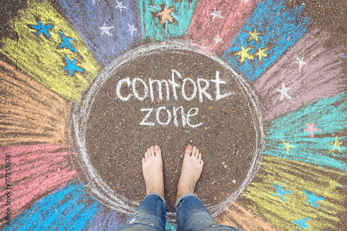 Obraz na plátne Comfort zone concept. Feet standing inside comfort zone circle.
