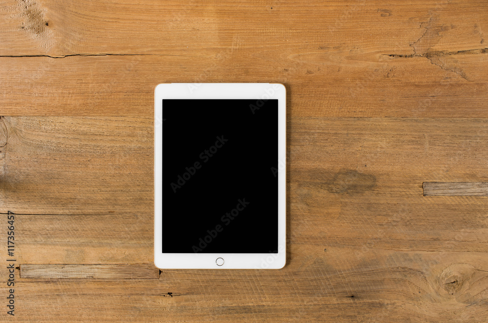 Digital tablet on wooden background. Digital tablet on wooden background.