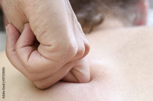 Фотография Physitoterapist / chiroprator doing a back massage. Osteopathy