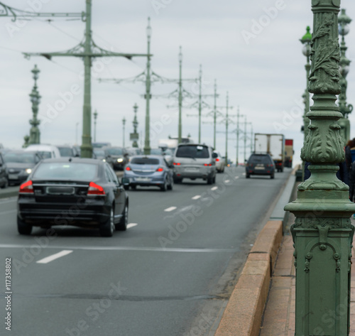 cars in blur on bridge at cloudy day