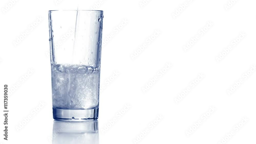 Filling up empty glass with carbonated water. Bubbles go up, drop of water rolls down the side of glass. White background, reflecting surface. Closeup shot. 4K Ultra HD.
Filling up empty glass with carbonated water. Bubbles go up, drop of water rolls down the side of glass. White background, reflecting surface. Closeup shot. 4K Ultra HD.