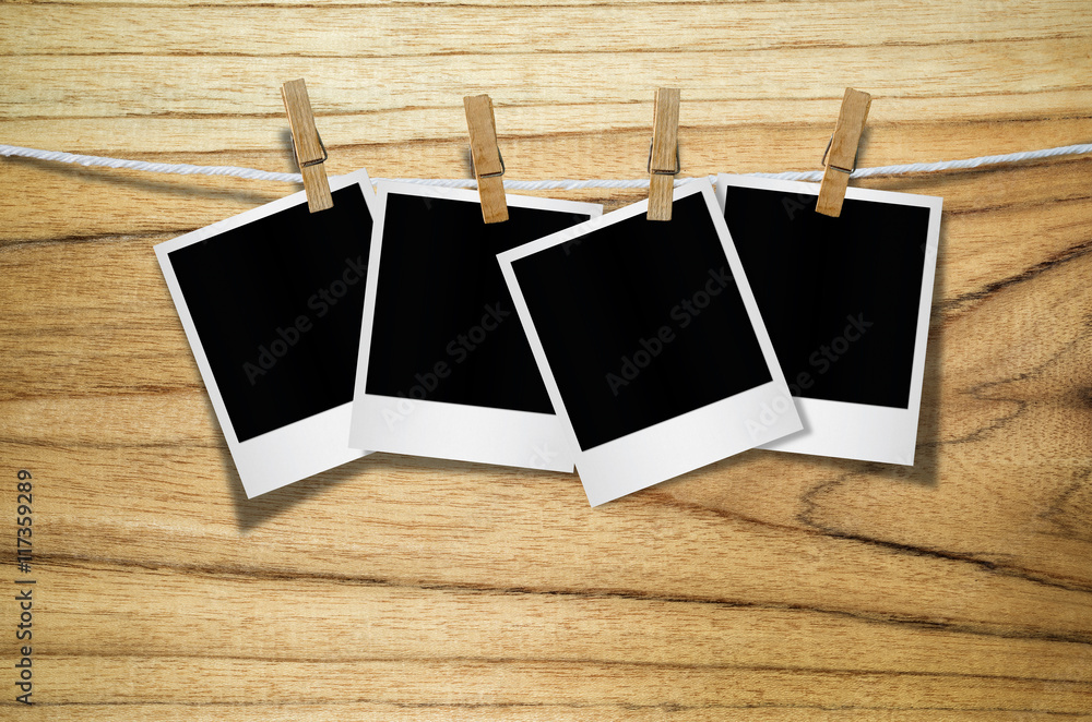 Blank photo frame with clothespin hanging. Blank photo frame with clothespin hanging.