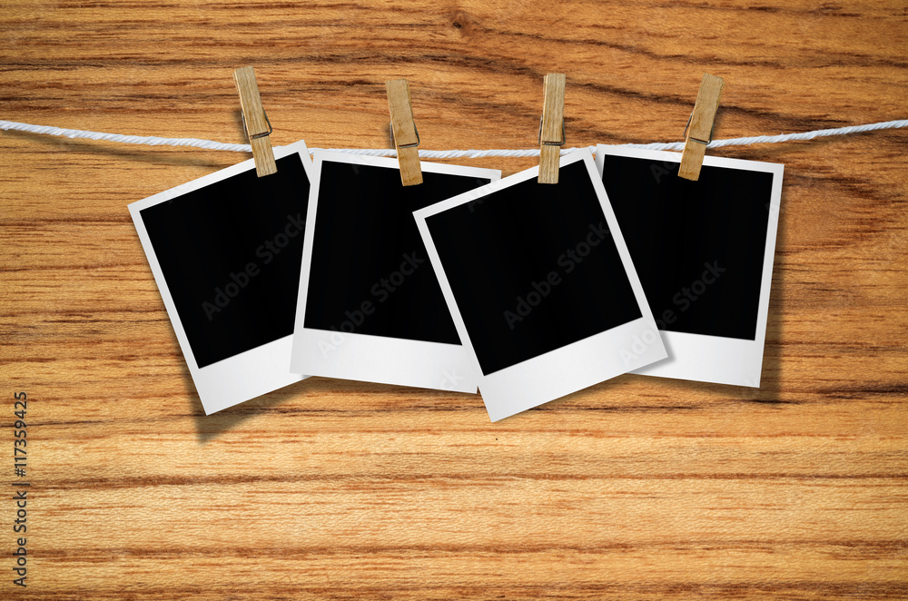 Blank photo frame with clothespin hanging. Blank photo frame with clothespin hanging.