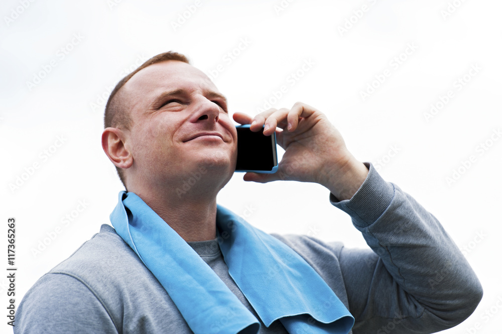 Active man talking by cell phone. Active man talking by cell phone.