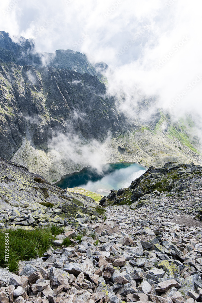 rocky mountain landscape covered with clouds