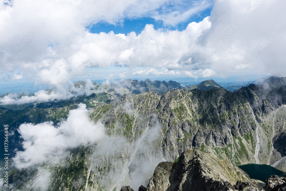 rocky mountain landscape covered with clouds