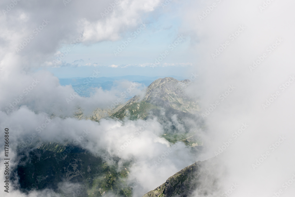 rocky mountain landscape covered with clouds rocky mountain landscape covered with clouds