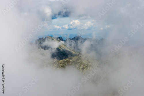 rocky mountain landscape covered with clouds
