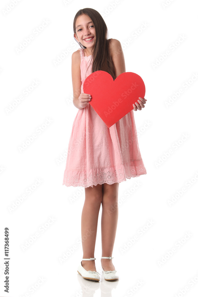 Lovely girl holding a red heart shape, over white background. Love concept Lovely girl holding a red heart shape, over white background. Love concept