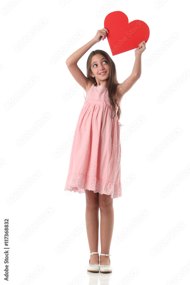 Lovely girl holding a red heart shape, over white background. Love concept Lovely girl holding a red heart shape, over white background. Love concept