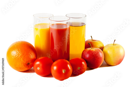 Apple  orange and tomato  with juices in the glasses isolated