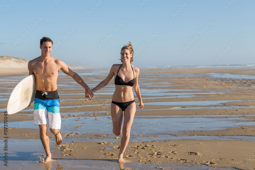 couple walking on the beach.sunset