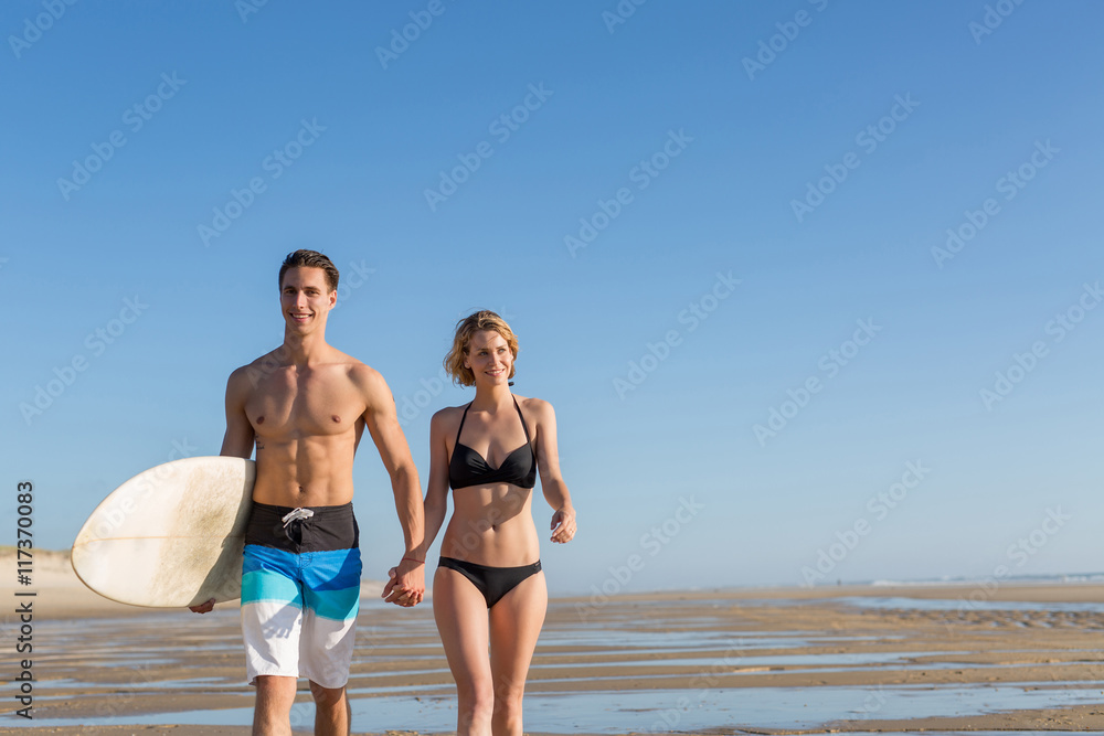 couple walking on the beach.sunset