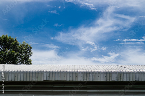 Metal sheet roof building with blue sky background