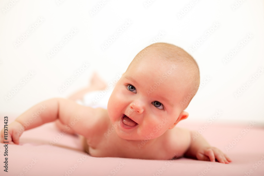 Portrait of adorable baby.Baby lying on his stomach Portrait of adorable baby.Baby lying on his stomach