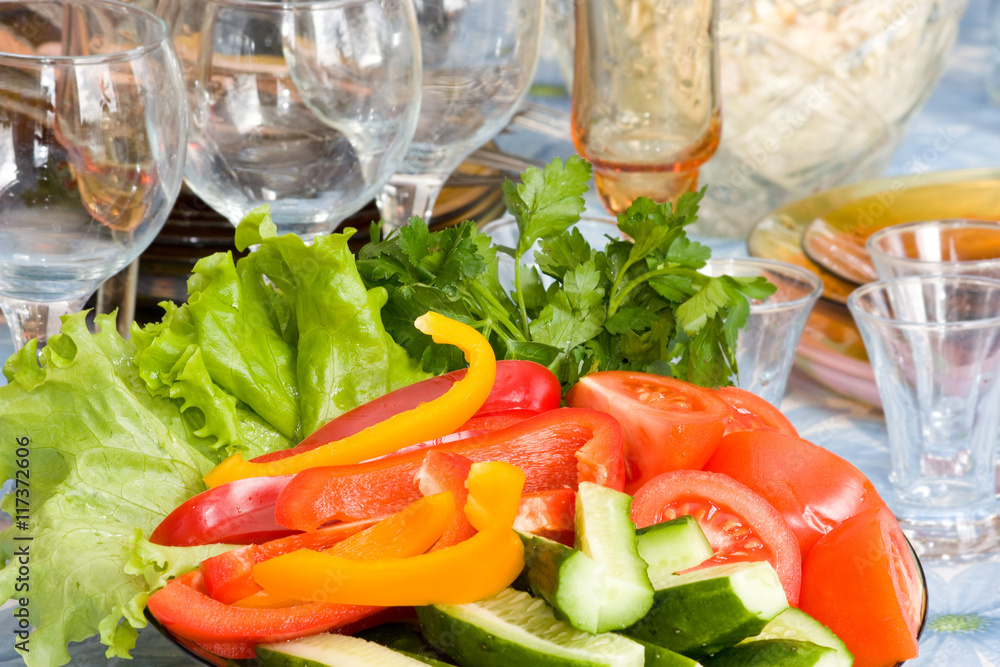 Raw vegetables cut into pieces on a platter Raw vegetables cut into pieces on a platter
