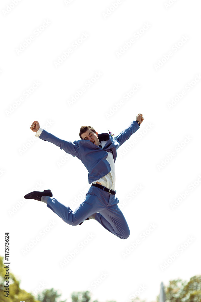 Groom is jumping from the happiness Groom is jumping from the happiness