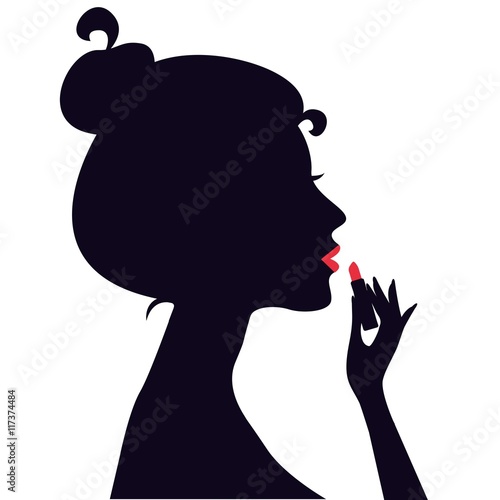 Woman applying lipstick