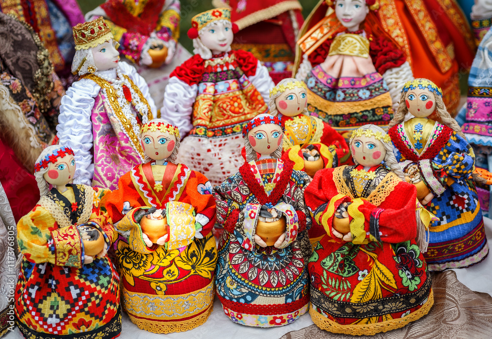 SUZDAL, RUSSIA - JULY 16, 2016: Feast of cucumber in Suzdal, handmade dolls