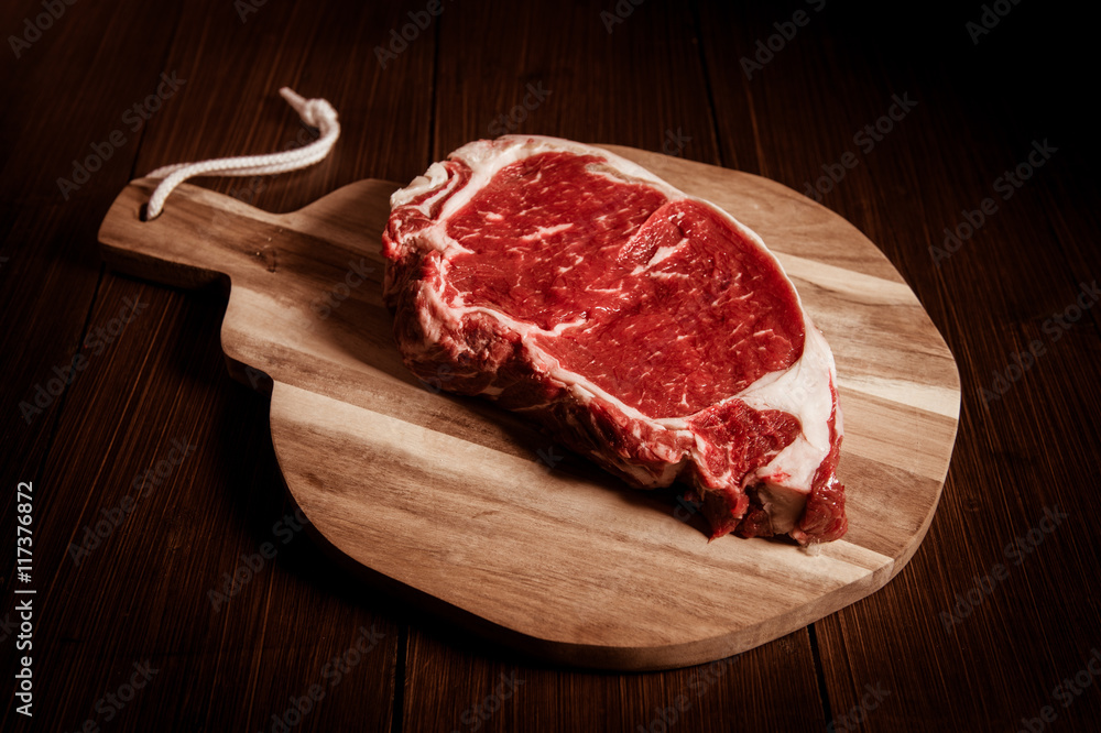 Entrecote steak of beef on a wooden board