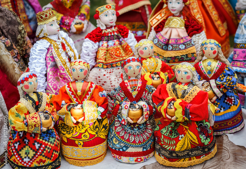 SUZDAL, RUSSIA - JULY 16, 2016: Feast of cucumber in Suzdal, handmade dolls