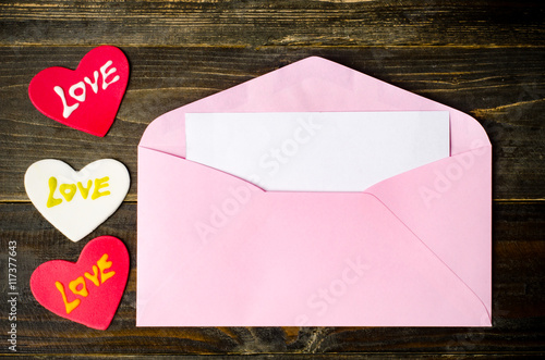 Pink envelope and blank white card  © nungning20