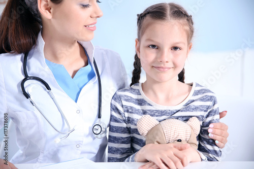 Cute girl visiting a doctor