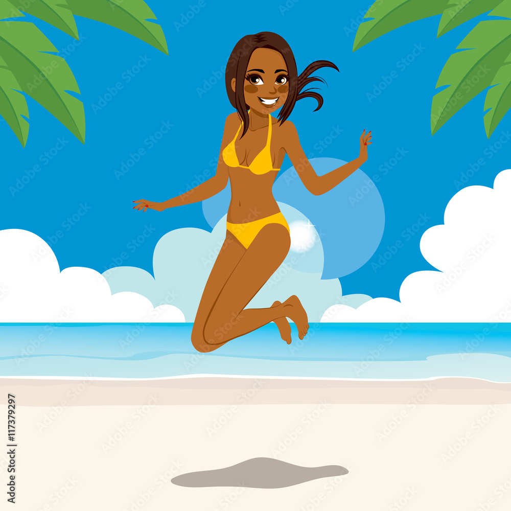 African American woman in bikini jumping happy on tropical beach
