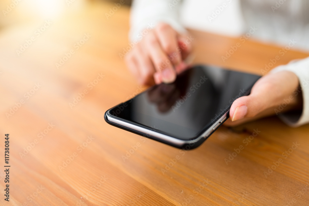 Woman holding with a cellphone Woman holding with a cellphone