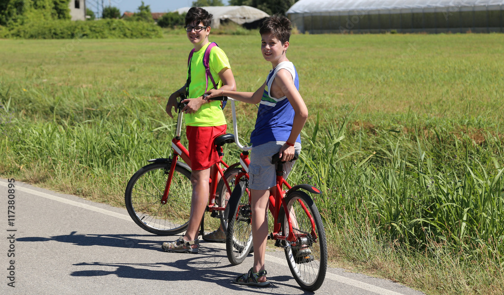 brothers by bike on the bike path brothers by bike on the bike path