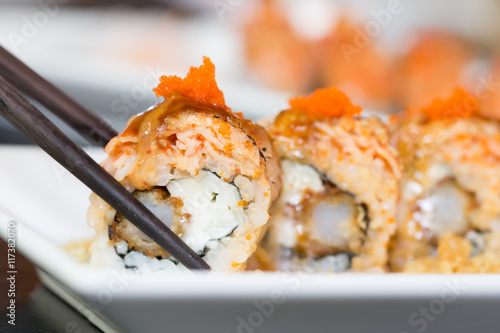 Sushi salmon and shrimp eggs roll with chopstick