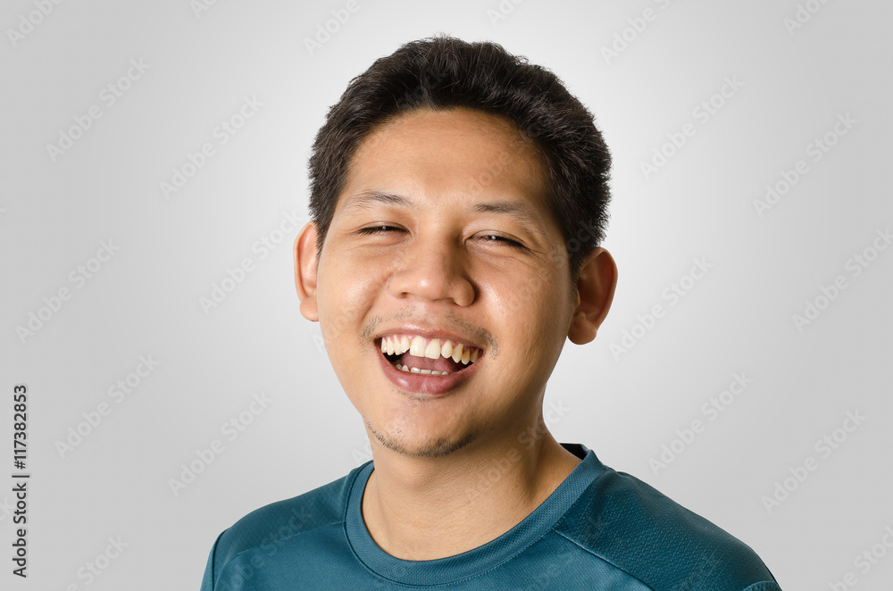 Portrait of smiling man isolated on gray background Portrait of smiling man isolated on gray background