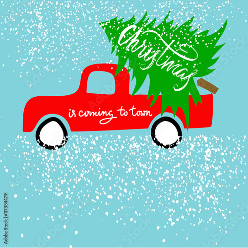 Red car carries Christmas spruce. Christmas is coming to town. Christmas Lettering.