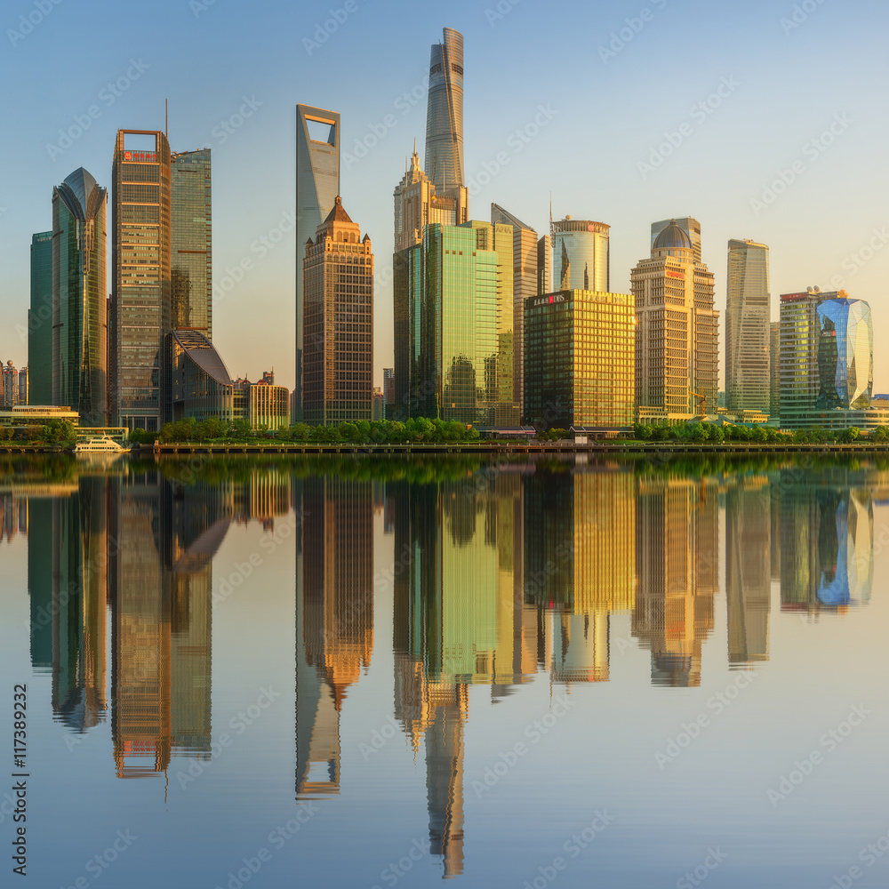 Cityscape of Shanghai and Huangpu River on sunset, beautiful reflection on skyscrapers, China
