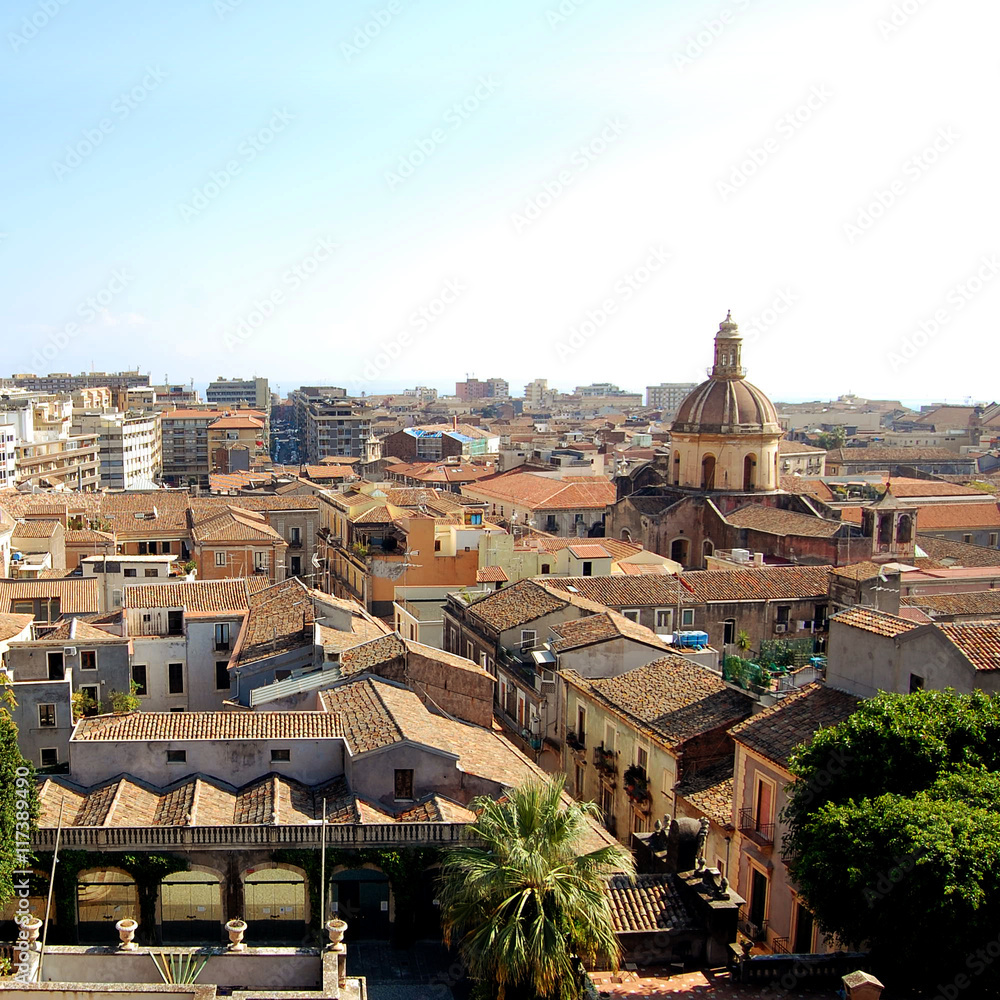 Old buildings and churches of central Catania. Retro photo. City View from the rooftop. Age dphoto. Mediterranean town. Sicily, Italy.