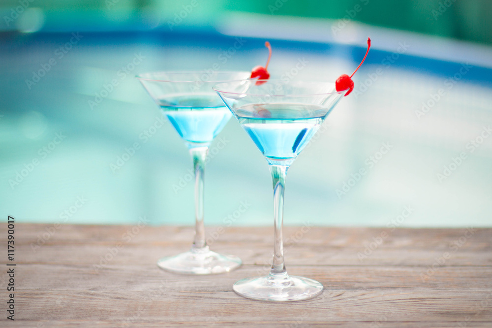 Blue cocktail with a cherry