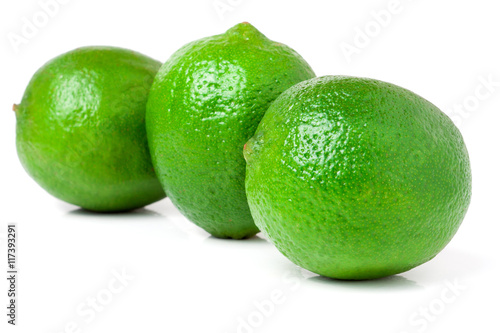 three lime isolated on white background close up