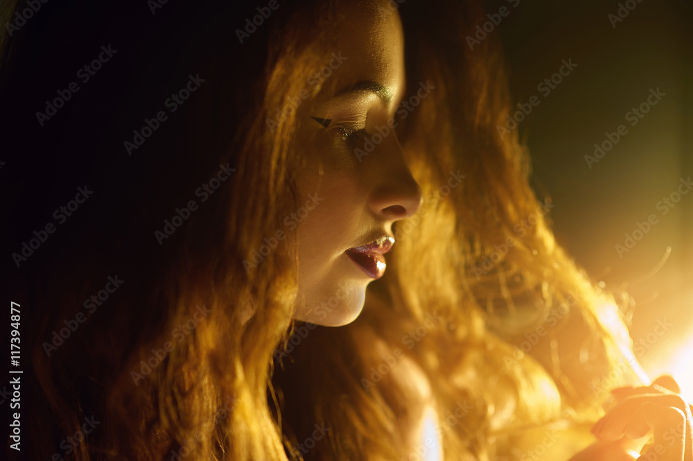 silhouette of a beautiful young woman backlit