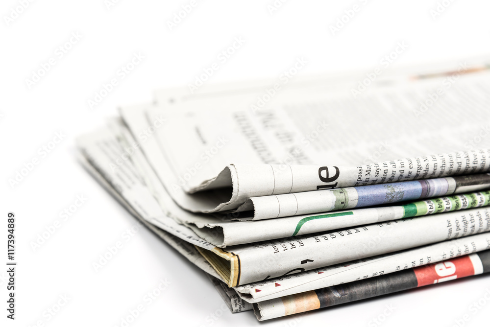 Stack of newspaper on white background. Image with clipping path. Stock