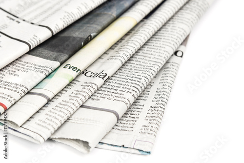 Stack of newspaper on white background © interstid