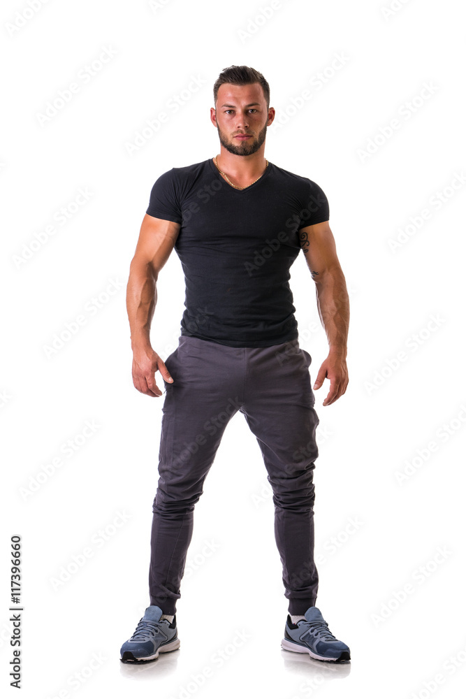 Handsome muscular man standing, isolated on white background in studio shot. Full length view Handsome muscular man standing, isolated on white background in studio shot. Full length view