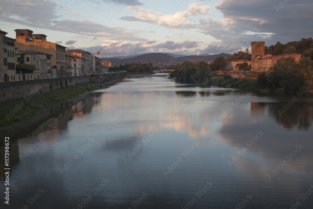 Sunset at a Tuscan landscape with the Arno river near the city of Florence, Italy
