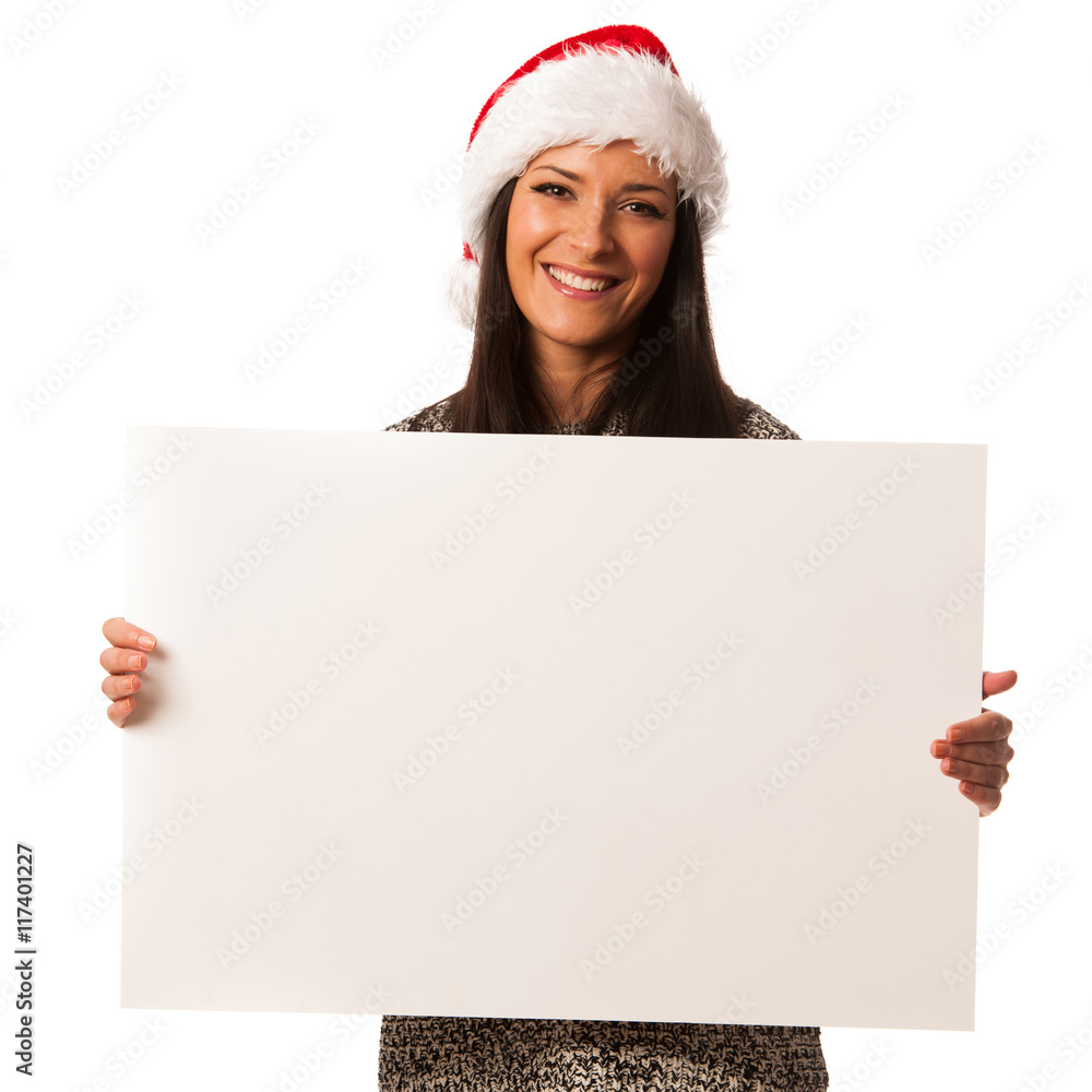 Young woman in santa hat holding blank board for advertisement. Young woman in santa hat holding blank board for advertisement.