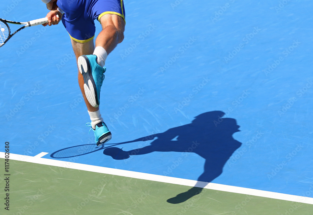 Tennis player serves the ball